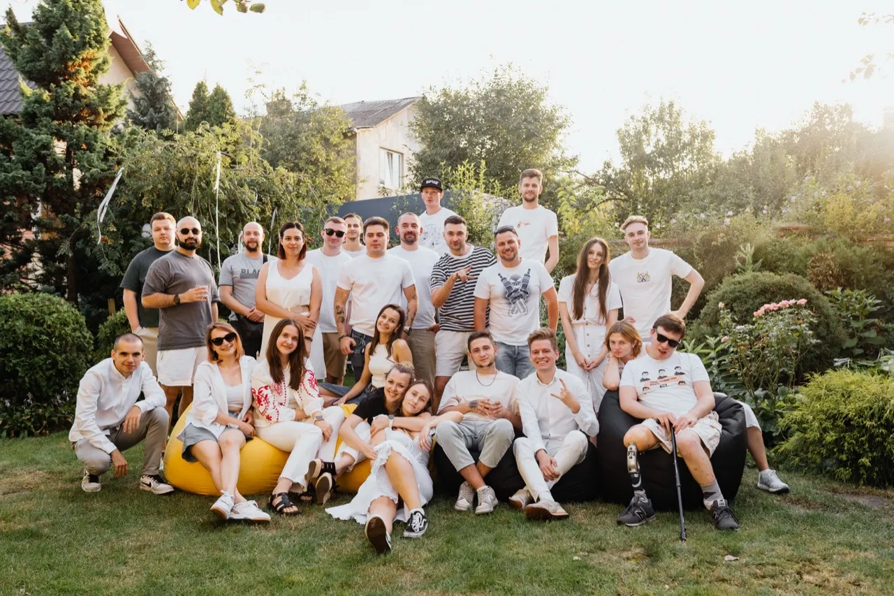Friends gathered for an outdoor group photo